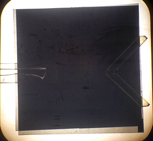 Plastic pieces between crossed polarizers